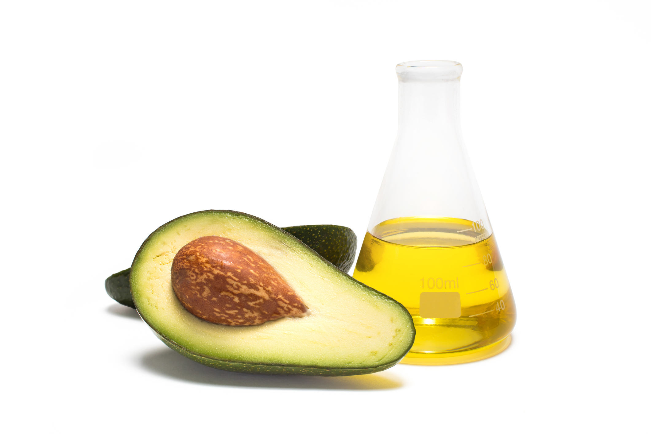 Avocado and oil on white background