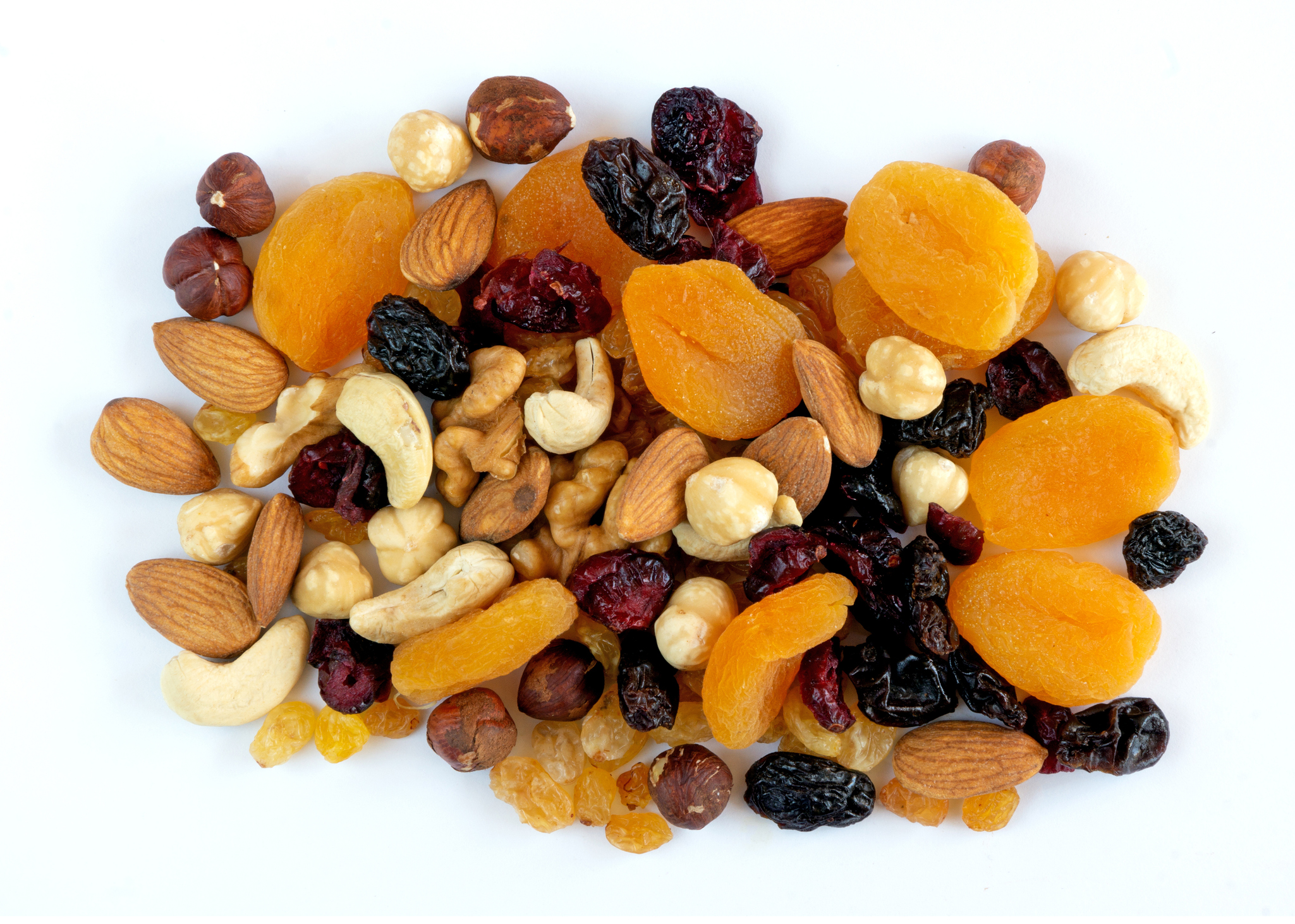 Dried fruits and nuts on white background